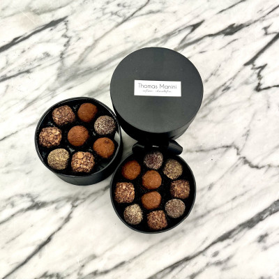 Two open boxes of truffles